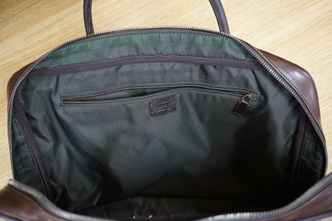 A Gucci supreme monogram travel case, 40cm wide